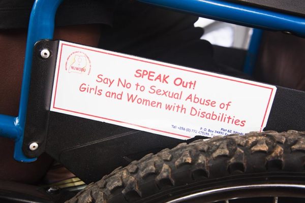 Sign on wheelchair, speak out, say no to sexual abuse of girls and women with disabilities.